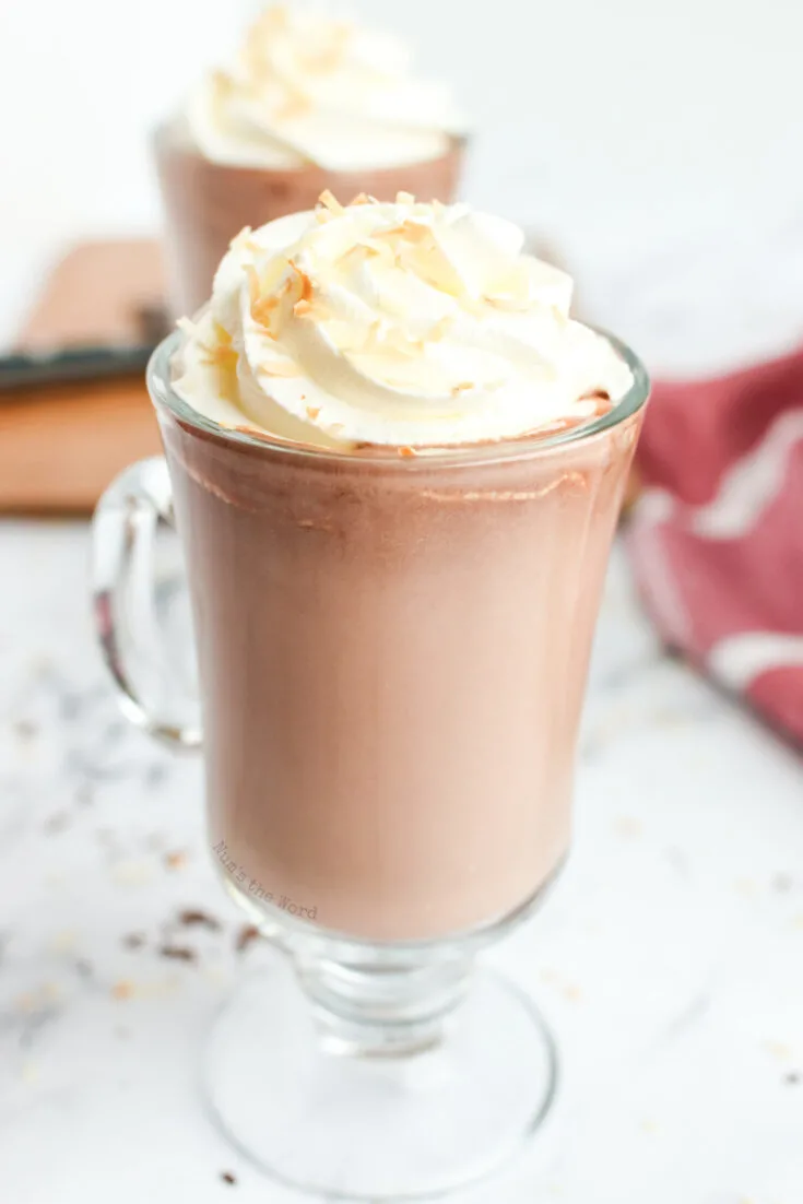 zoomed in image of 2 cups of hot chocolate ready to serve.