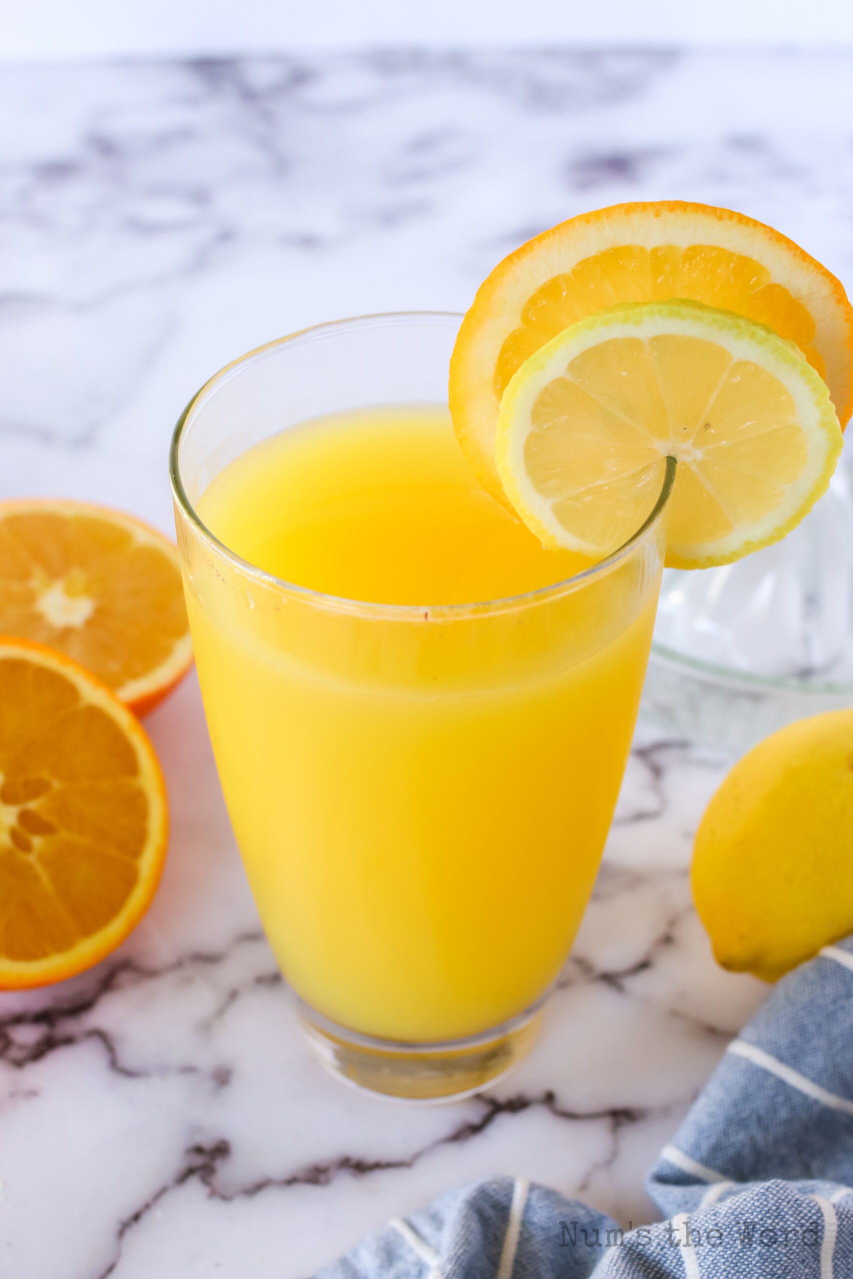 top side view of orange lemonade in a glass ready to enjoy