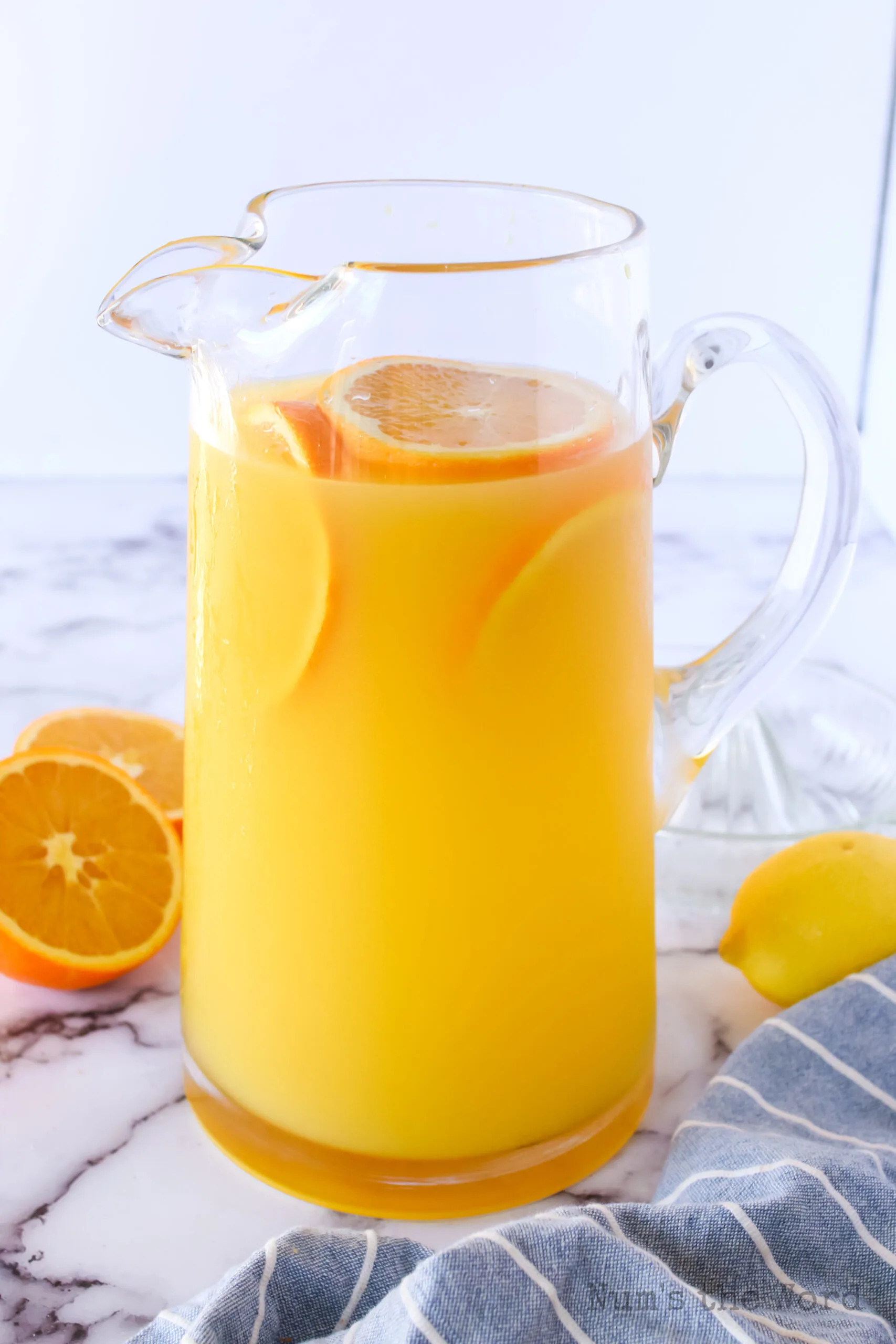 pitcher of orange lemonade ready to serve