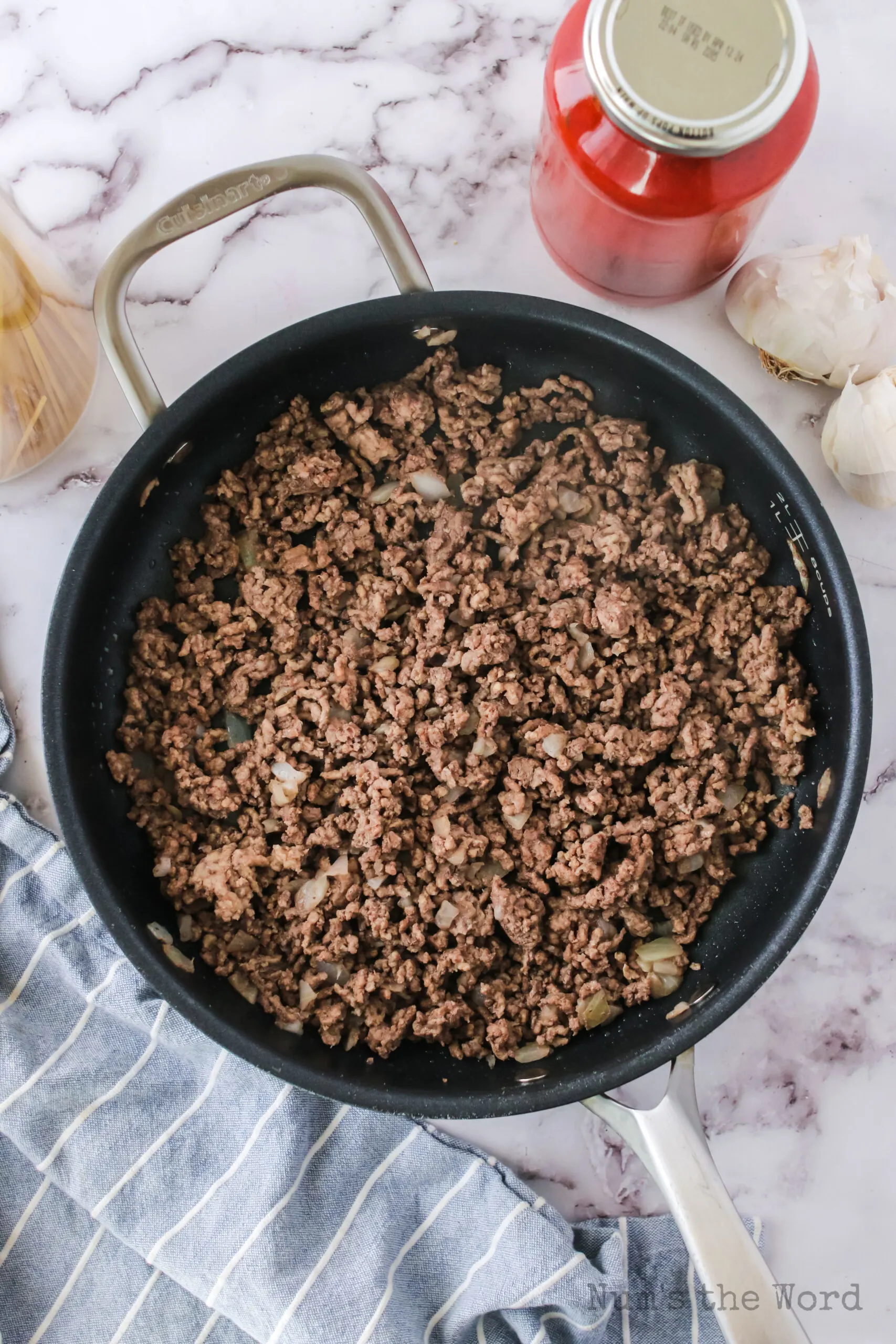 ground beef and onion cooked in a skillet