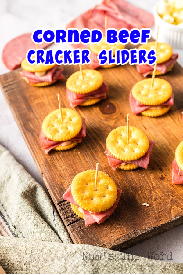 Main image for Corned Beef Cracker Sliders. Multiple sliders laid out on serving board.