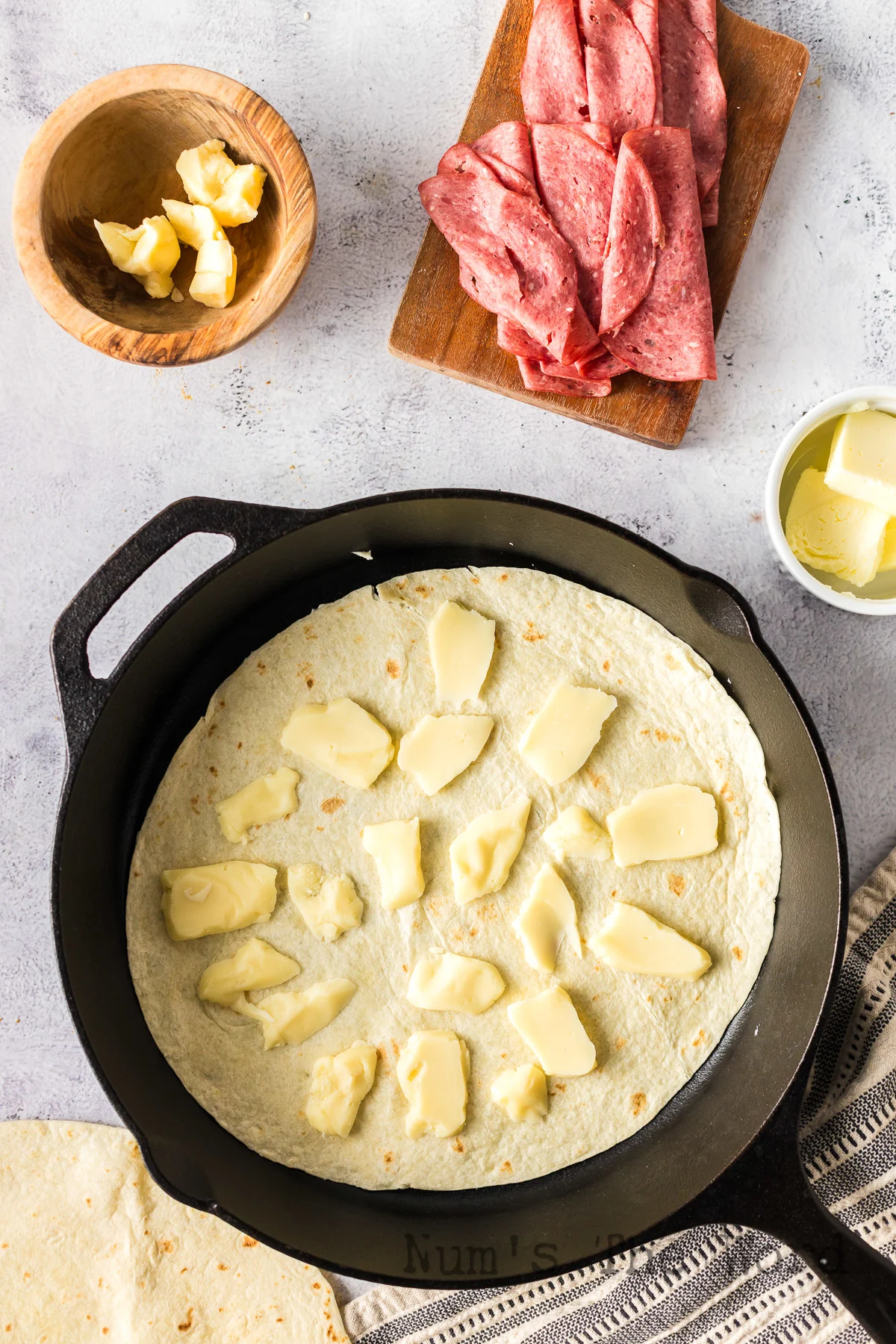 tortilla in skillet with cheese curds