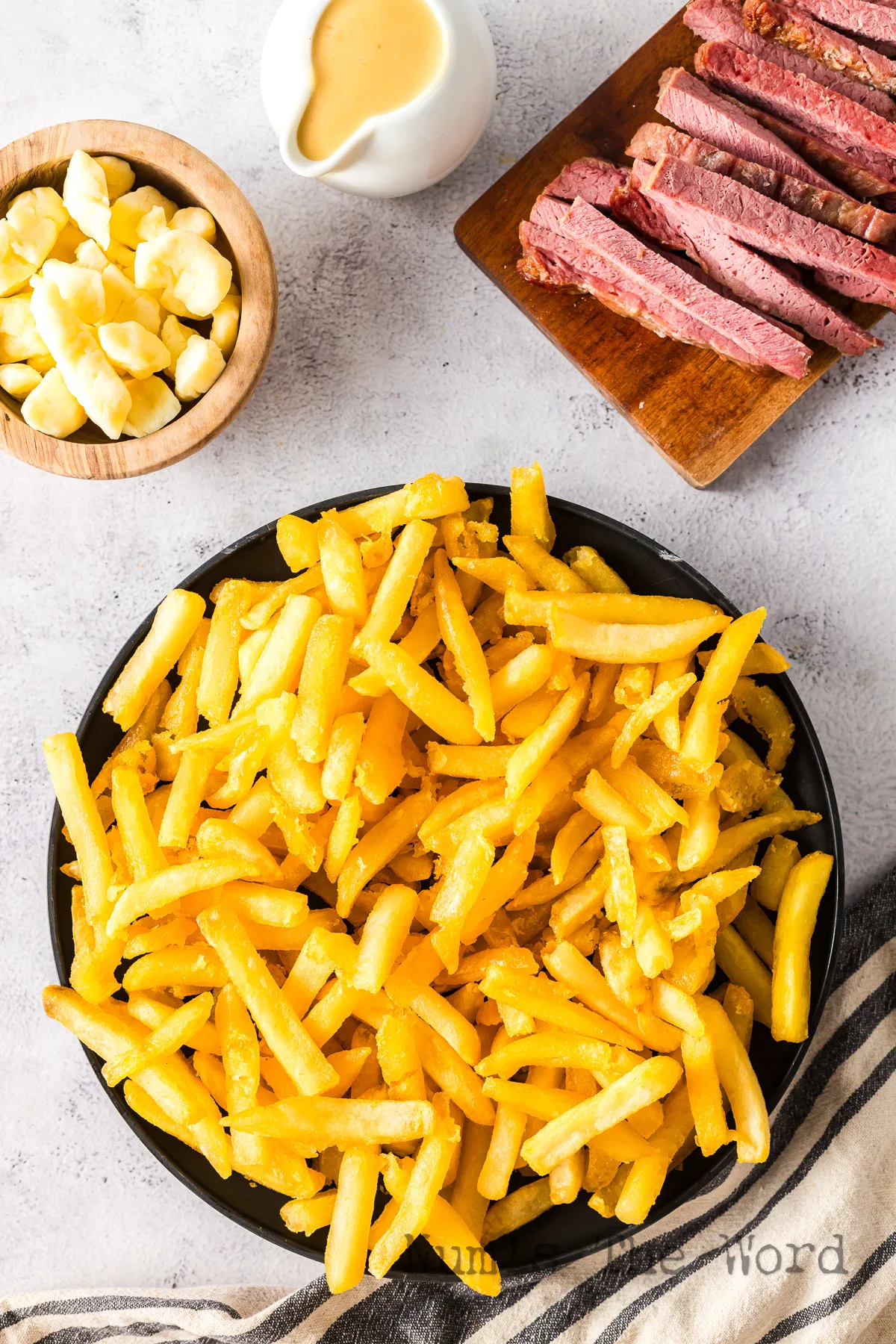 Hot french fries ready to turn into poutine.