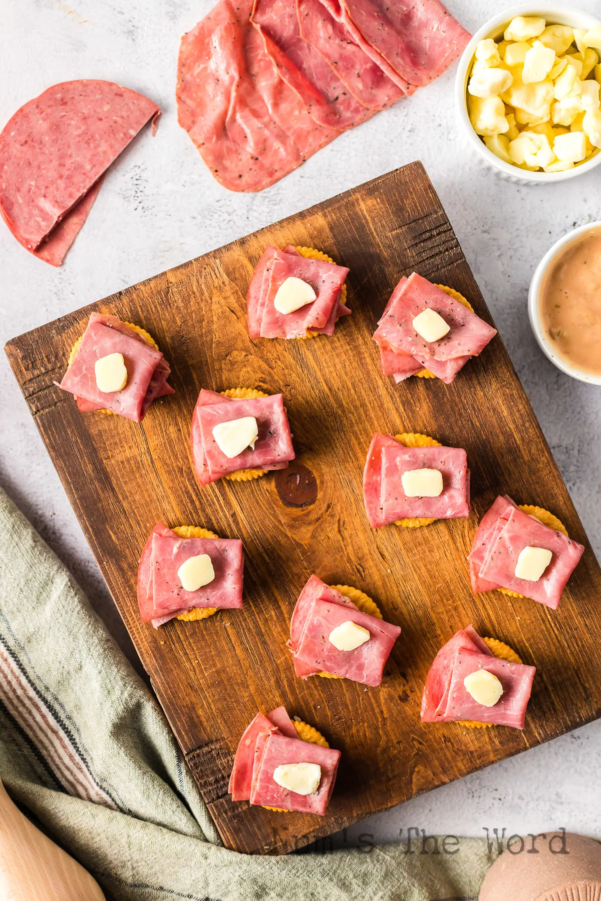 A cheese curd placed on top of corned beef.
