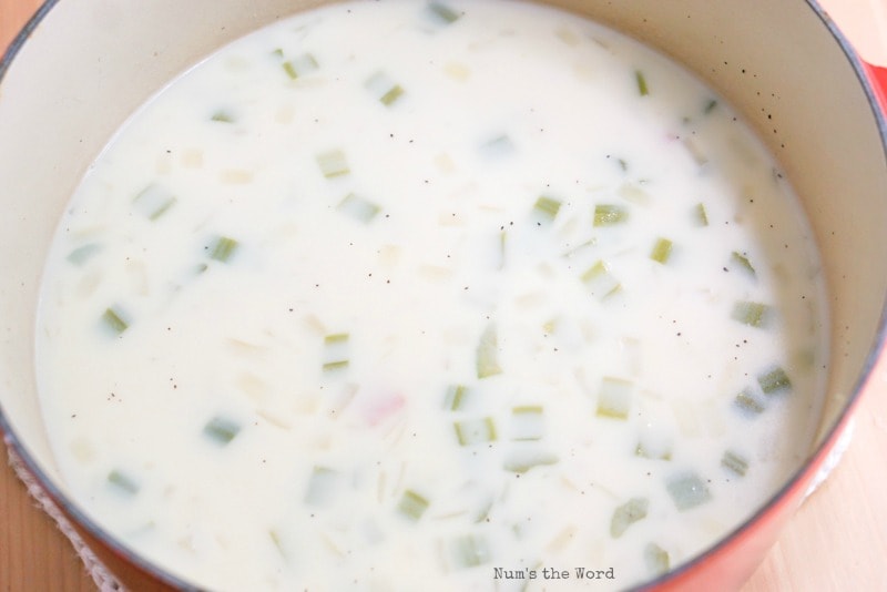 creamy mixture added to potato soup pot