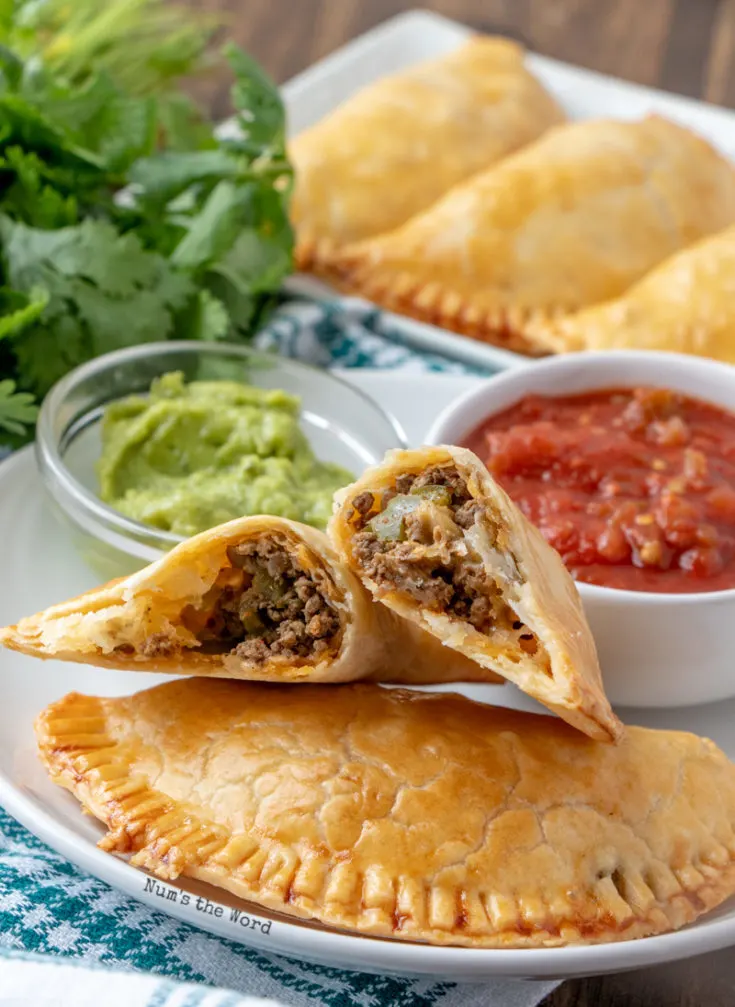 Beef Empanadas - one empanada cut in half to show yummy filling