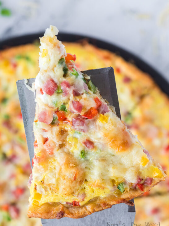 spatula lifting a pizza slice off pan.