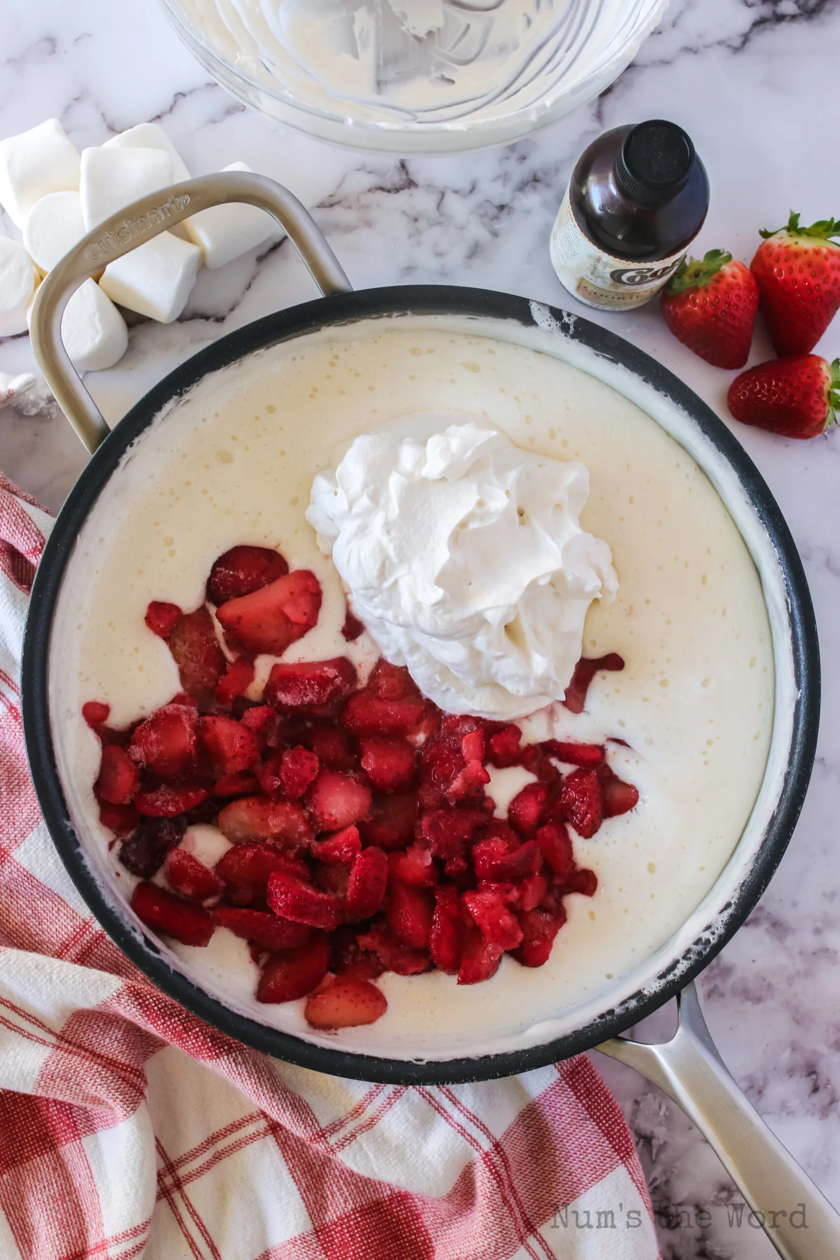 marshmallows melted and cooled with whipped cream and sliced strawberries added