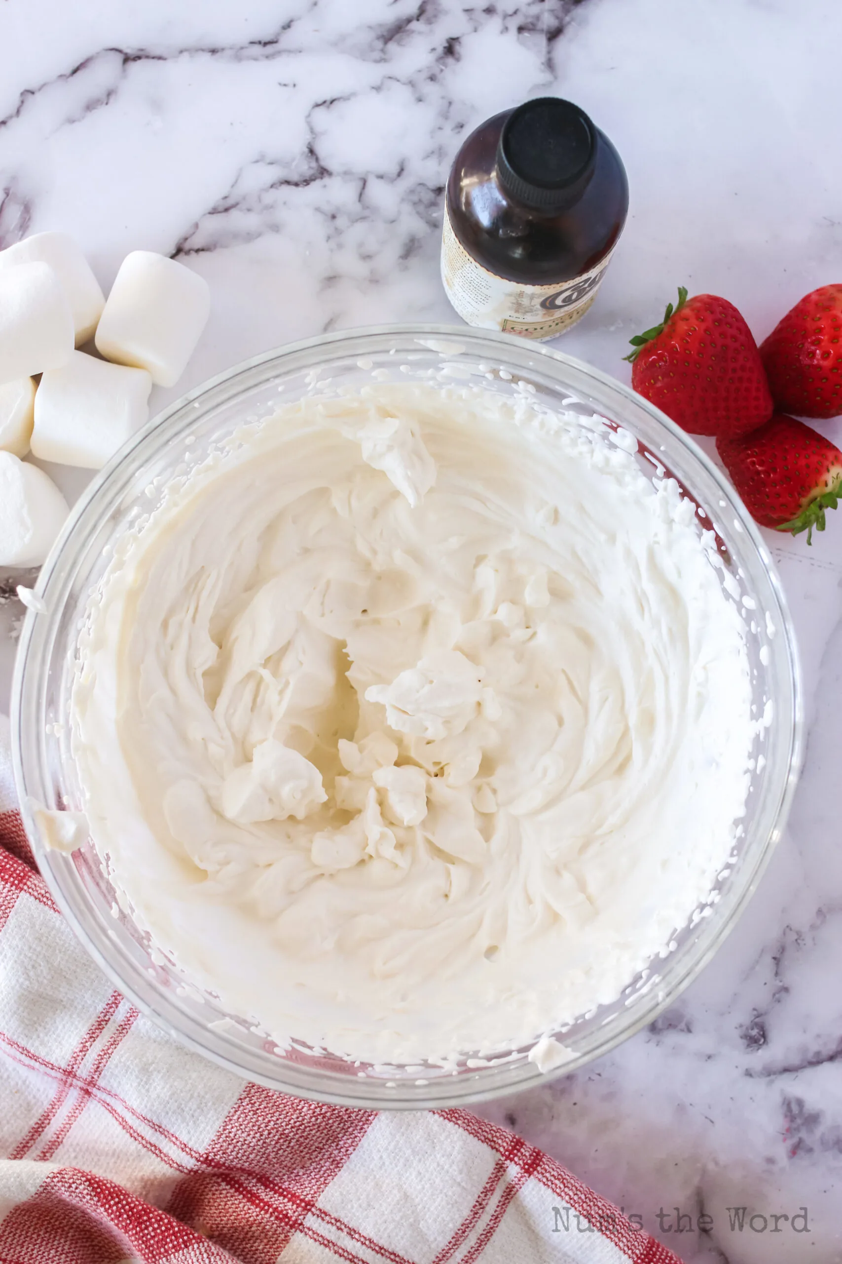 whipped cream with stiff peaks in a bowl