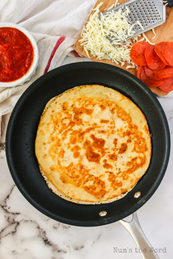 Cooked quesadilla in a skillet