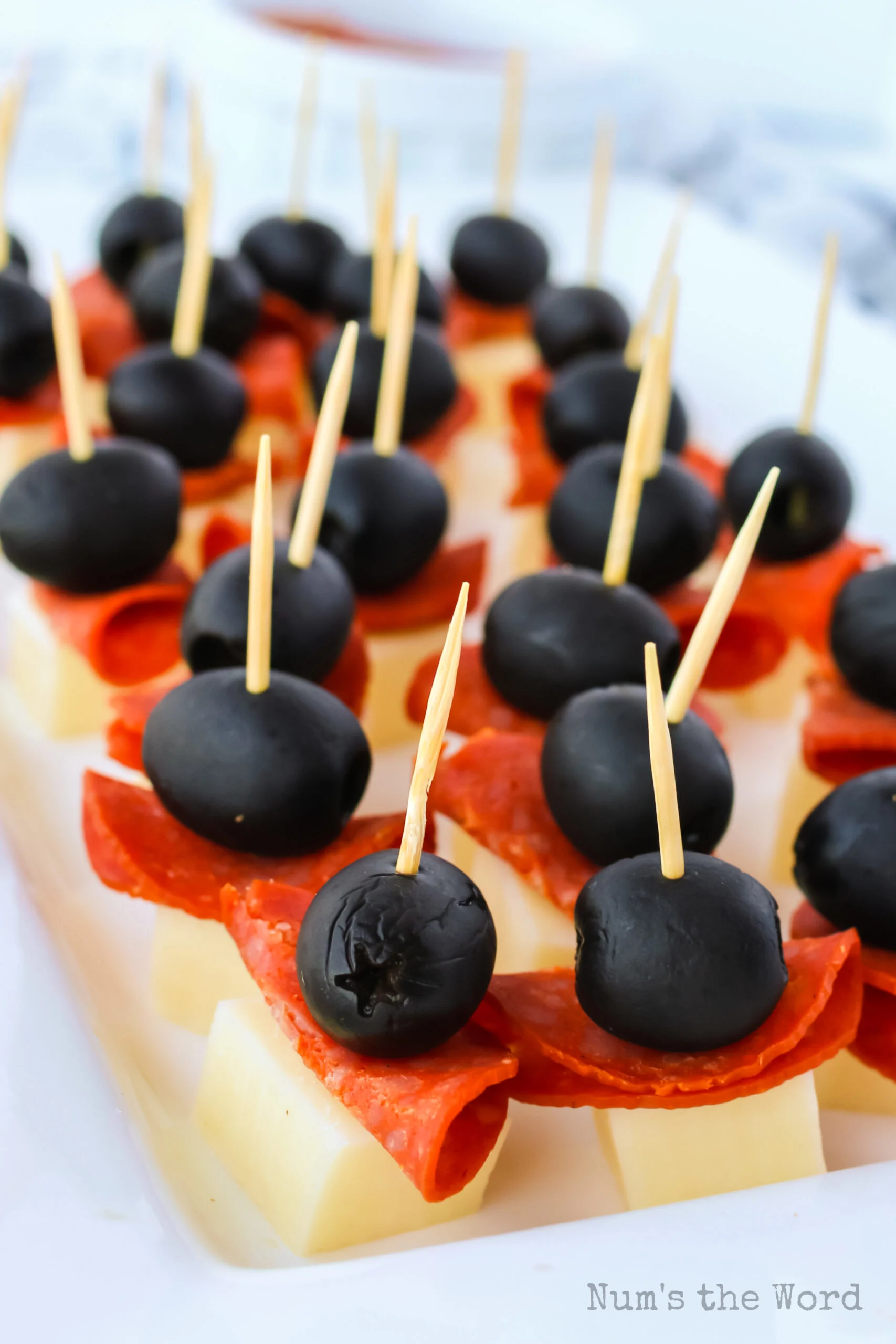 Finally a use for the giant martini glass you thought was such a great  idea! Caprese skewers!