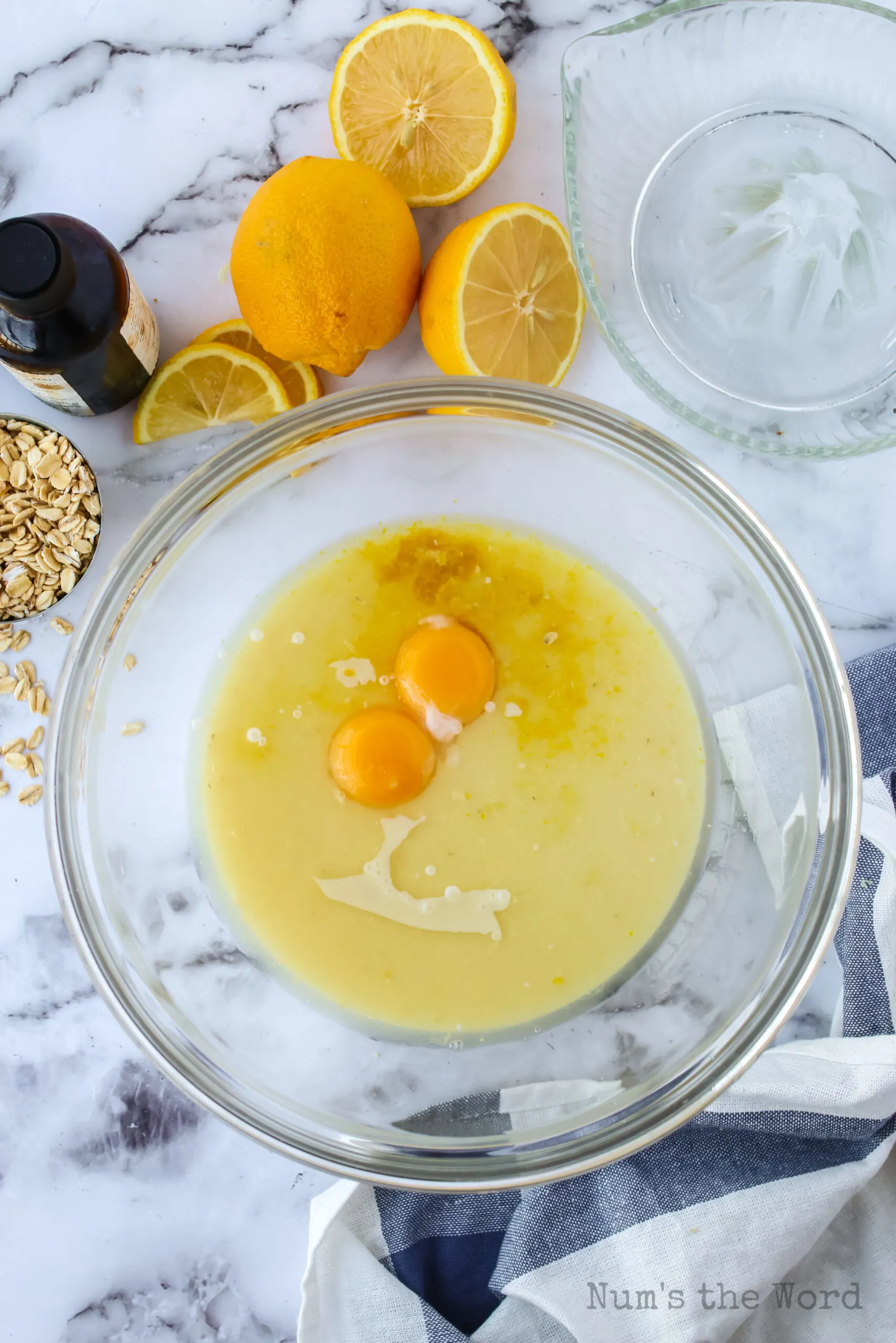 condensed milk, lemon zest, lemon juice, egg yolks, lemon extract in a bowl, unmixed