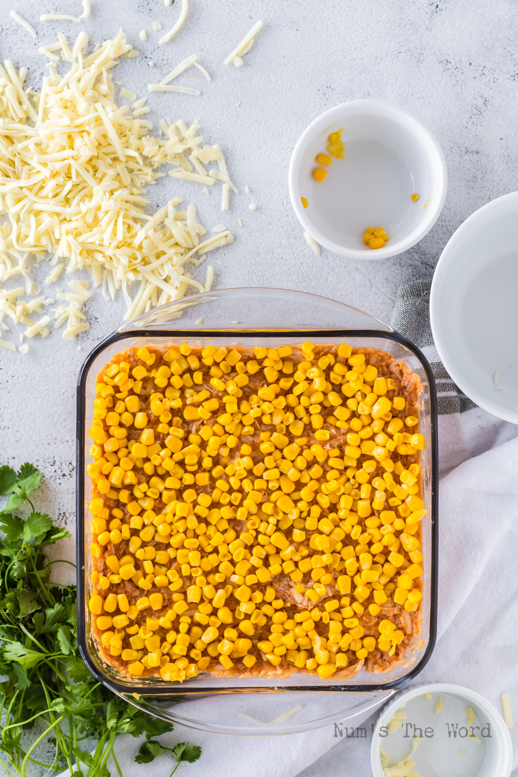 Chicken Rice Enchilada Casserole in dish with corn on top