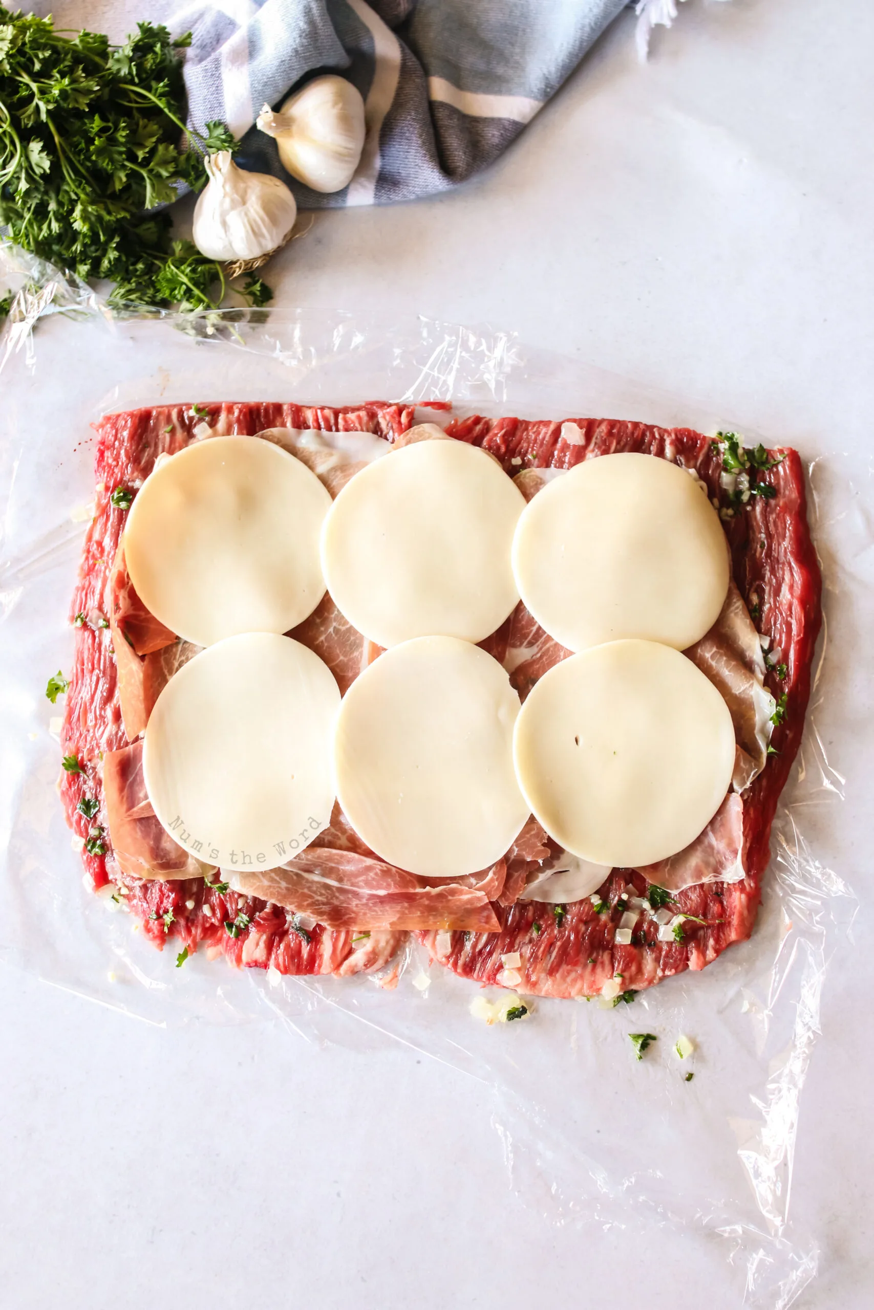 provolone cheese laid on top of prosciutto