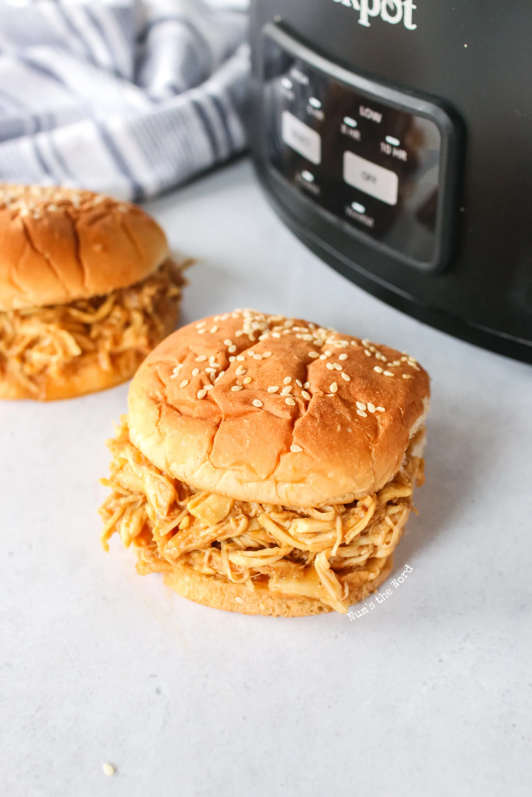 Two pulled pork sandwiches ready to be eaten