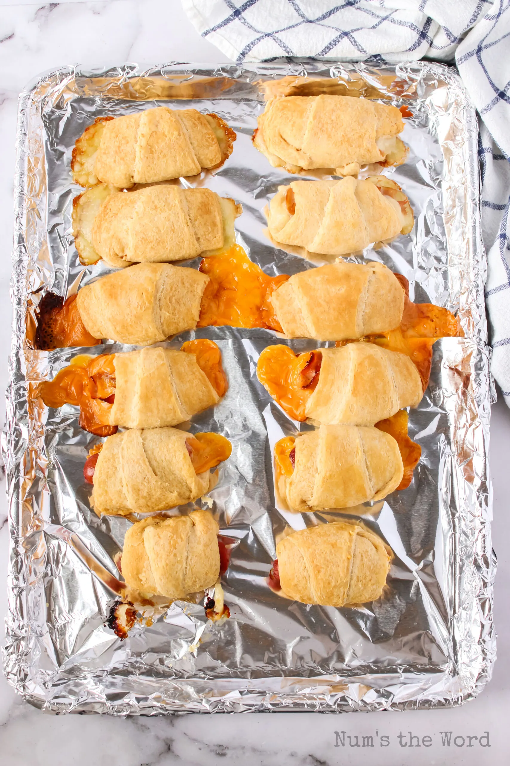crescent roll ups on a tray, baked