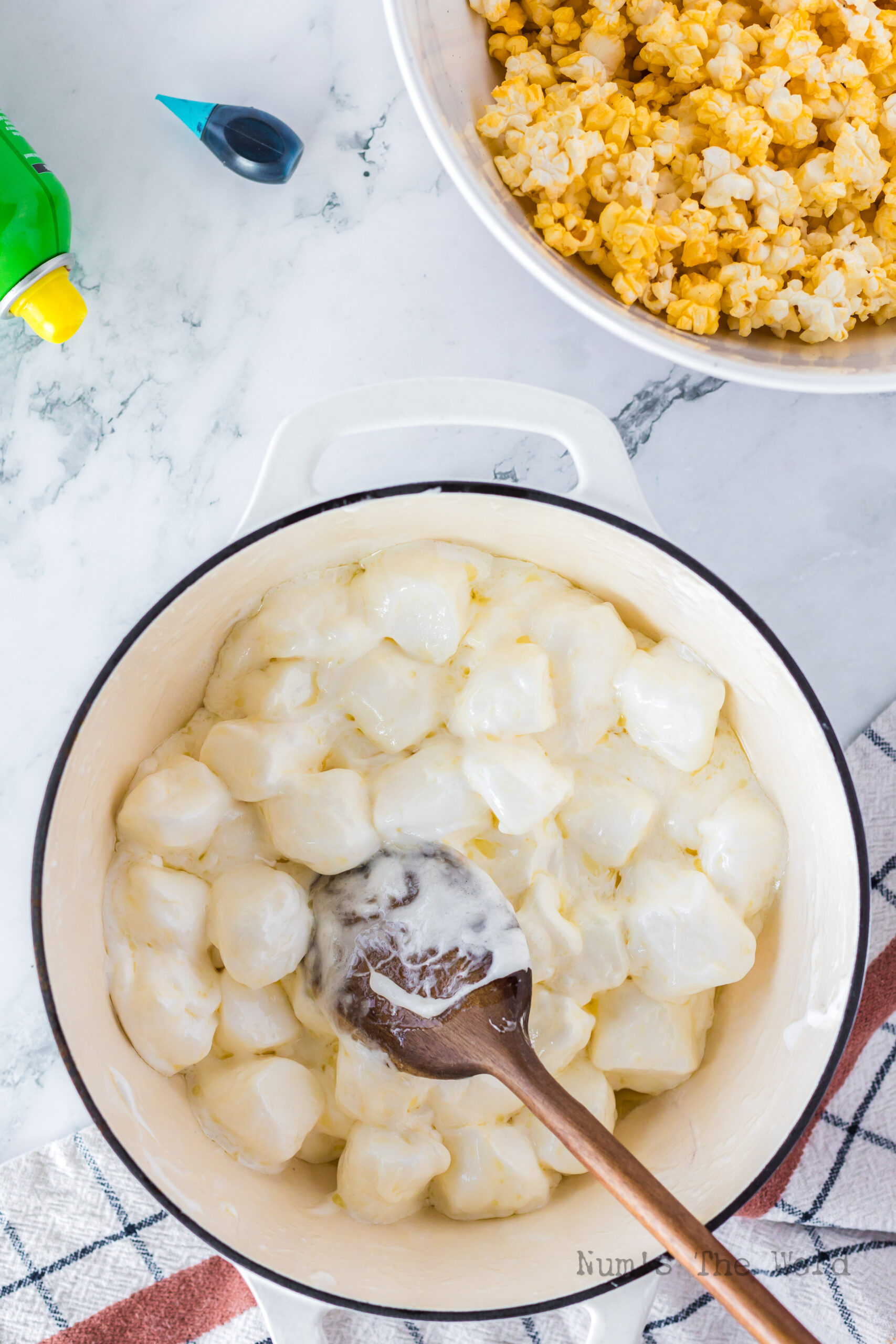 marshmallows and butter in pot with marshmallows fluffy and starting to melt