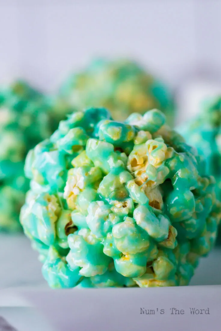 close up of popcorn balls laid out on counter