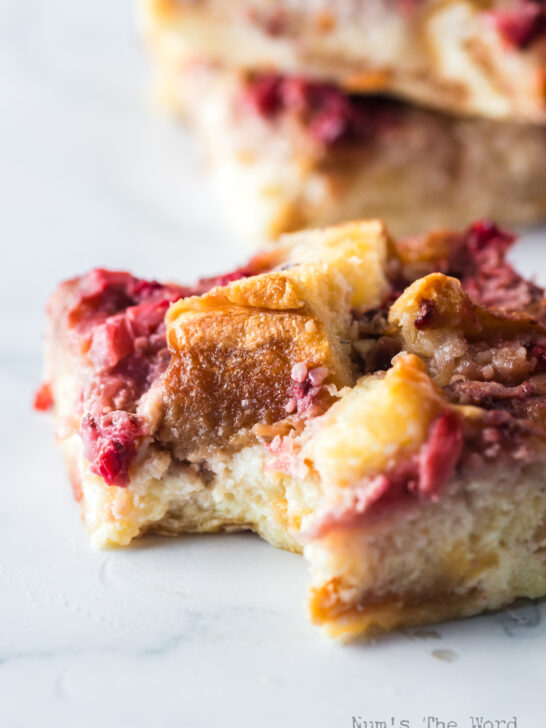 zoomed in image of a slice of bread pudding with a bite removed.