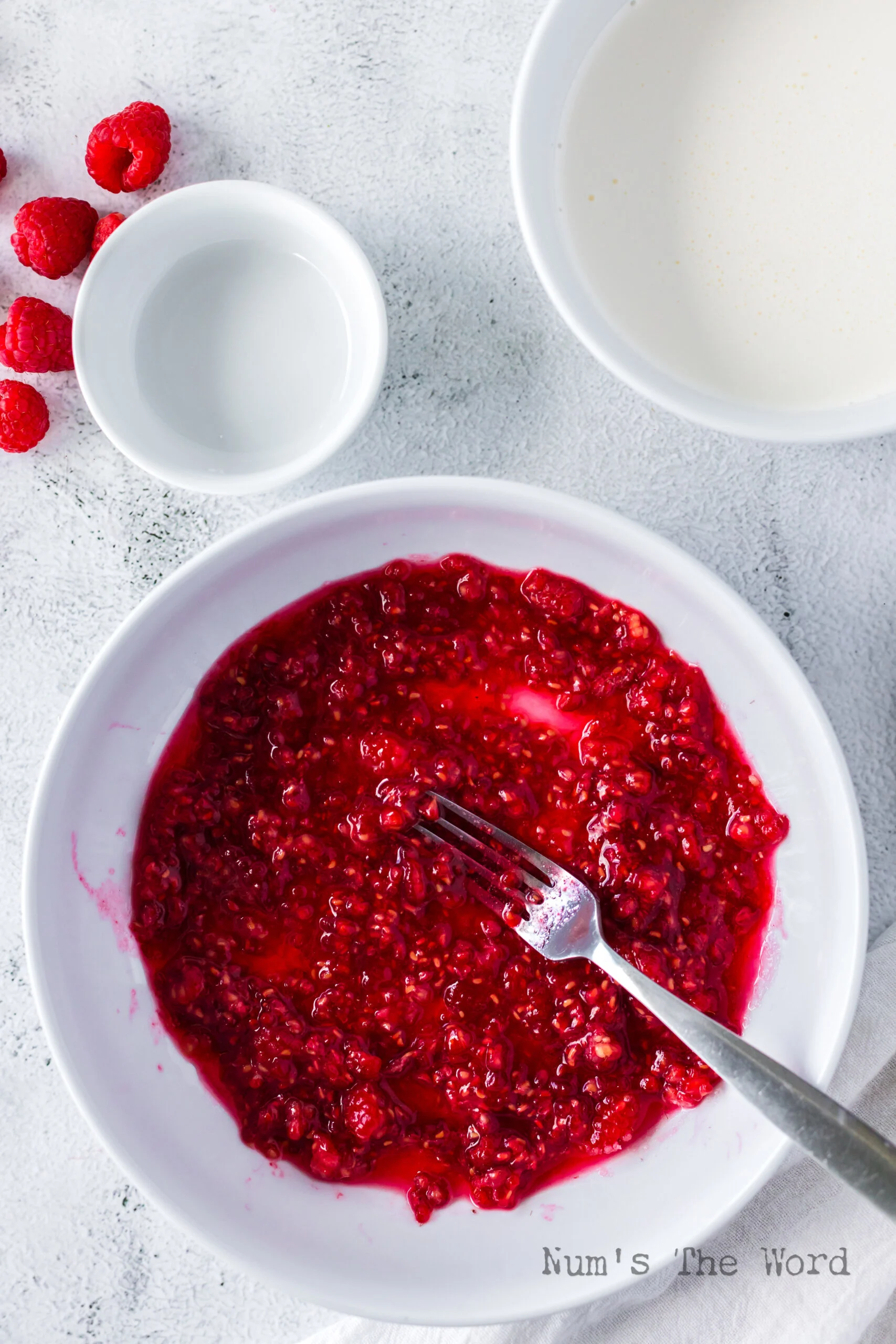 mashed raspberries with sugar in a bowl