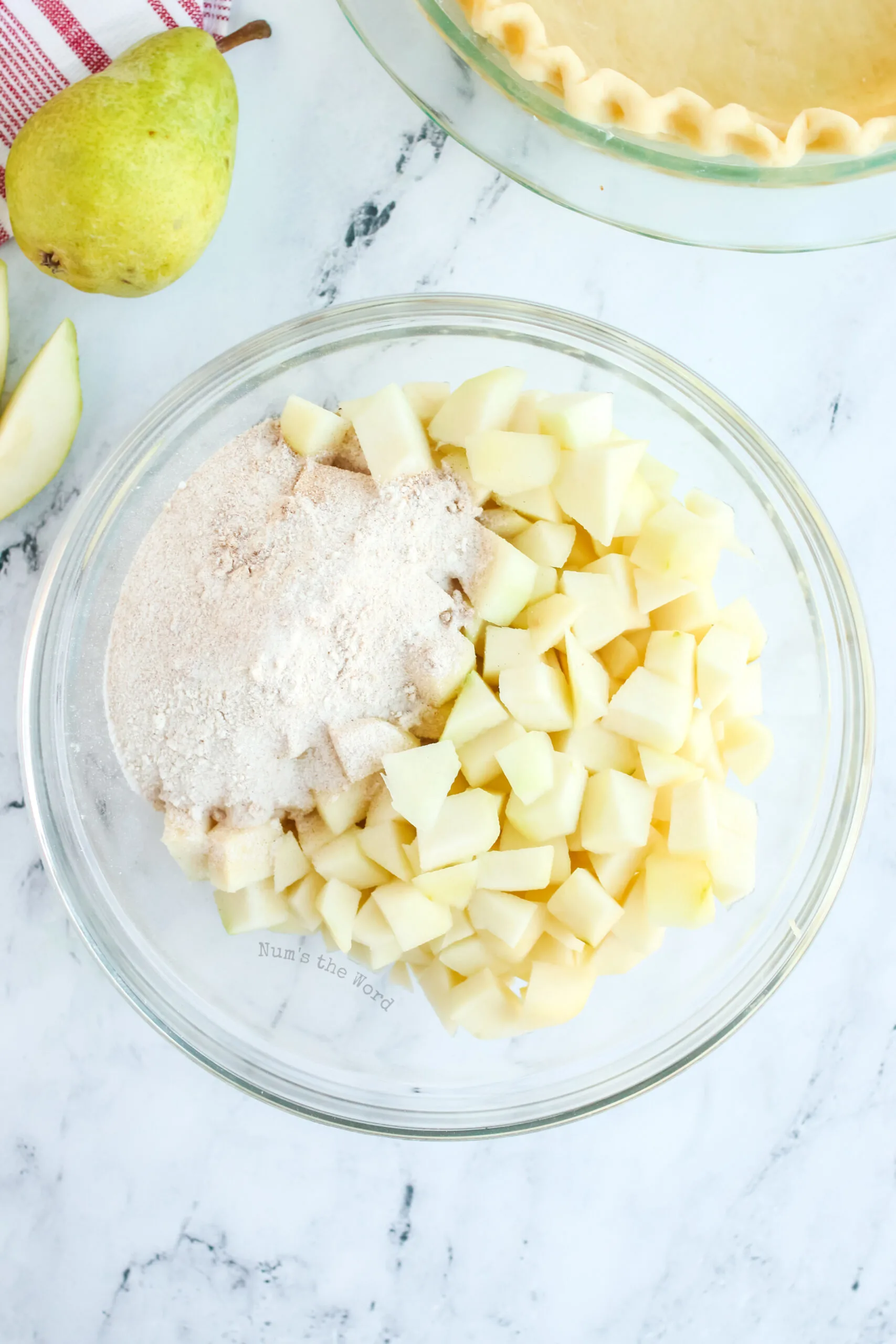 cinnamon mixture poured over pealed and sliced pears