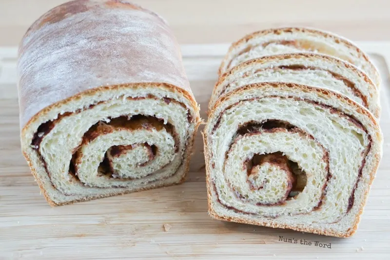 Cinnamon Roll Bread - several slices cut from bread with half a loaf uncut