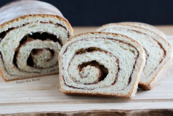 Cinnamon Roll Bread - side front angle of sliced bread to show yummy cinnamon swirls