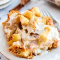 large slice of apple fritter casserole on plate side view.