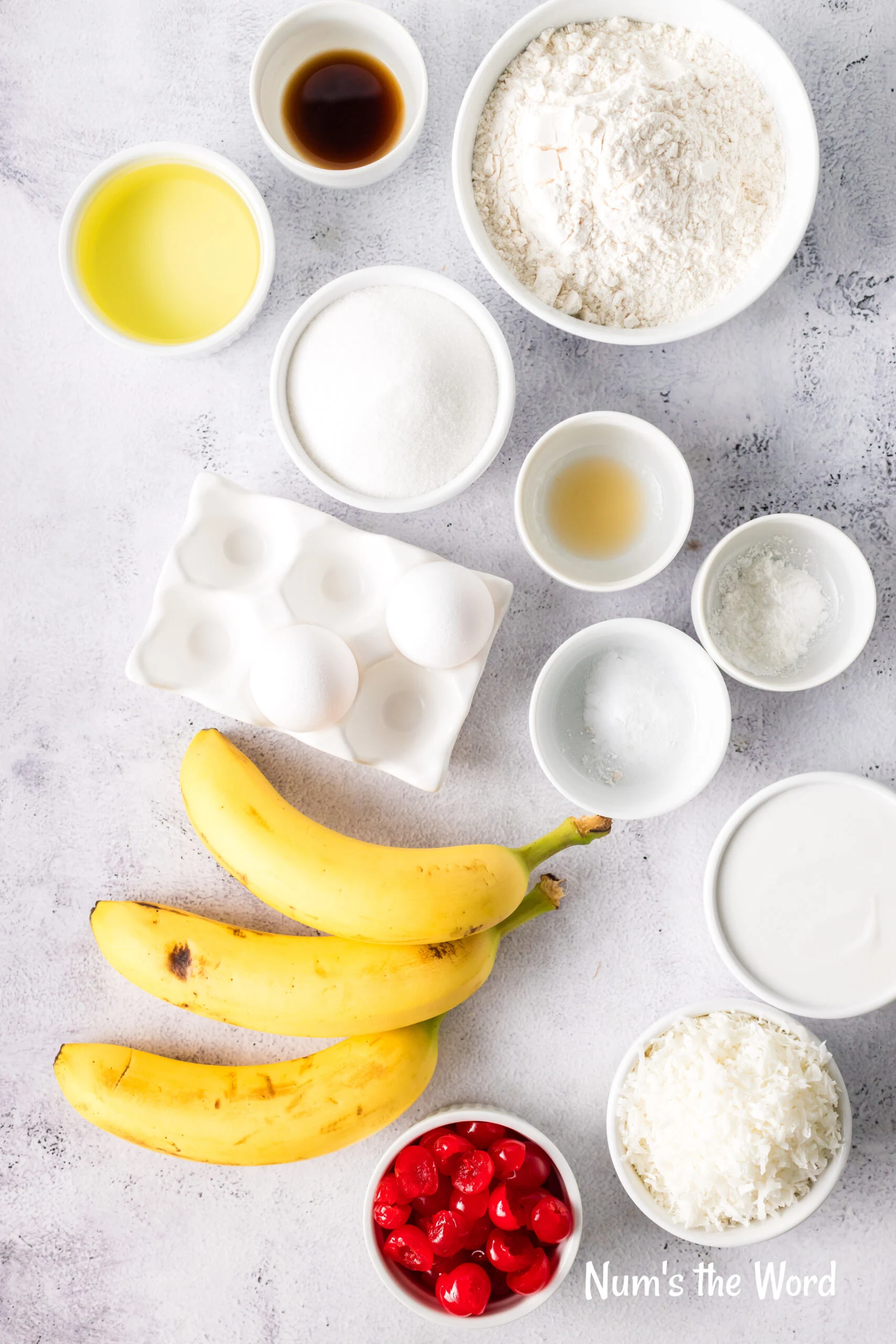 All ingredients for Tropical Banana Bread laid out on the counter.