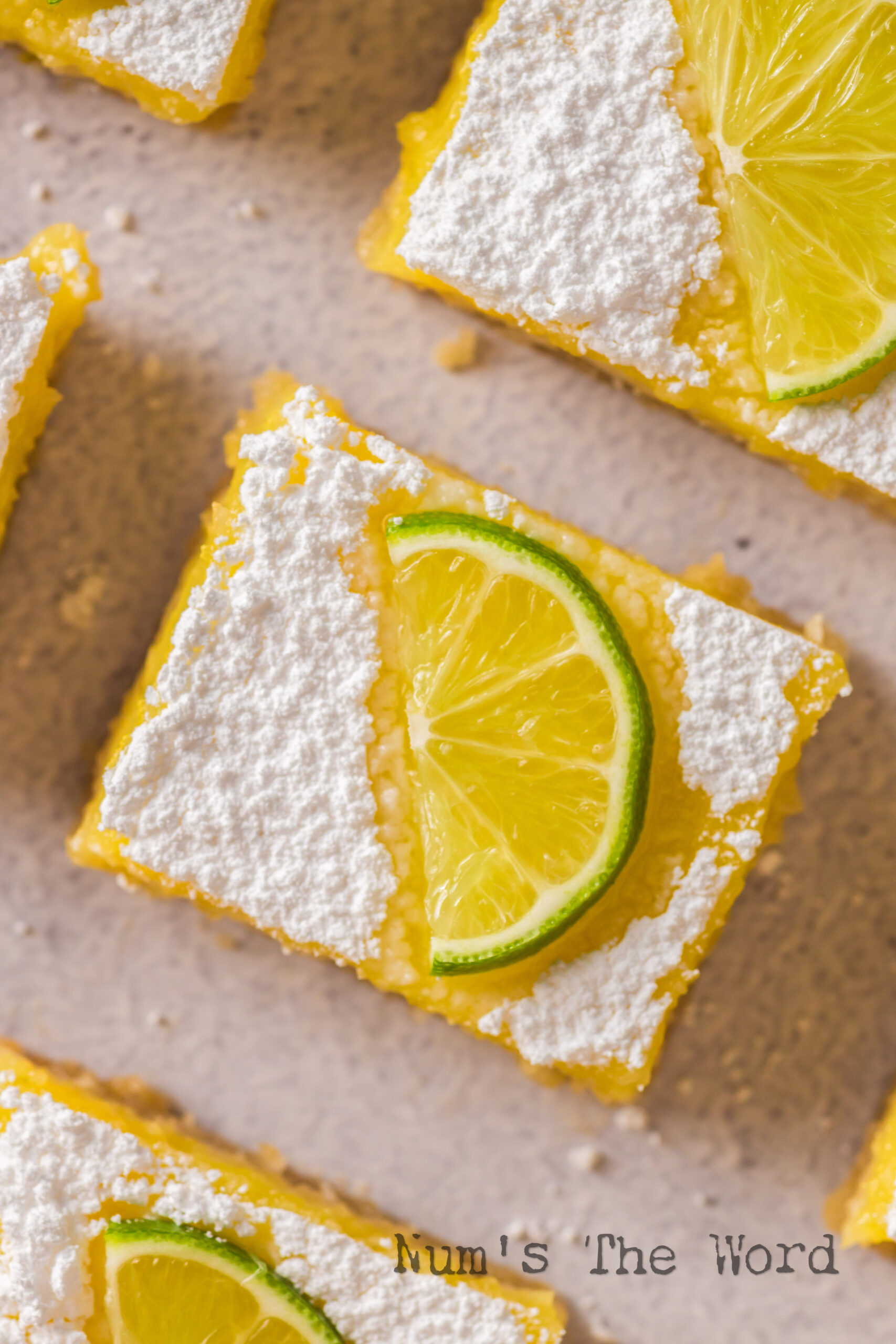 zoomed in image of lime curd bars cut and ready to serve.
