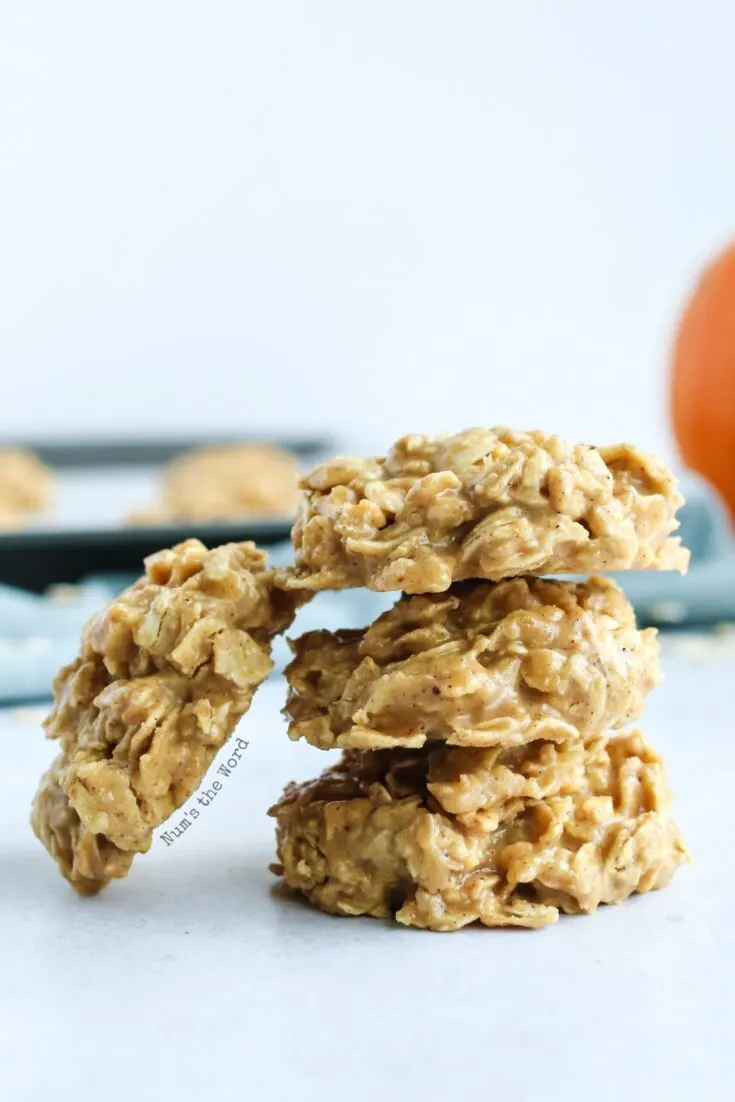 No Bake Pumpkin Spice Cookies - 3 cookies stacked on top of each other with one leaning on the side