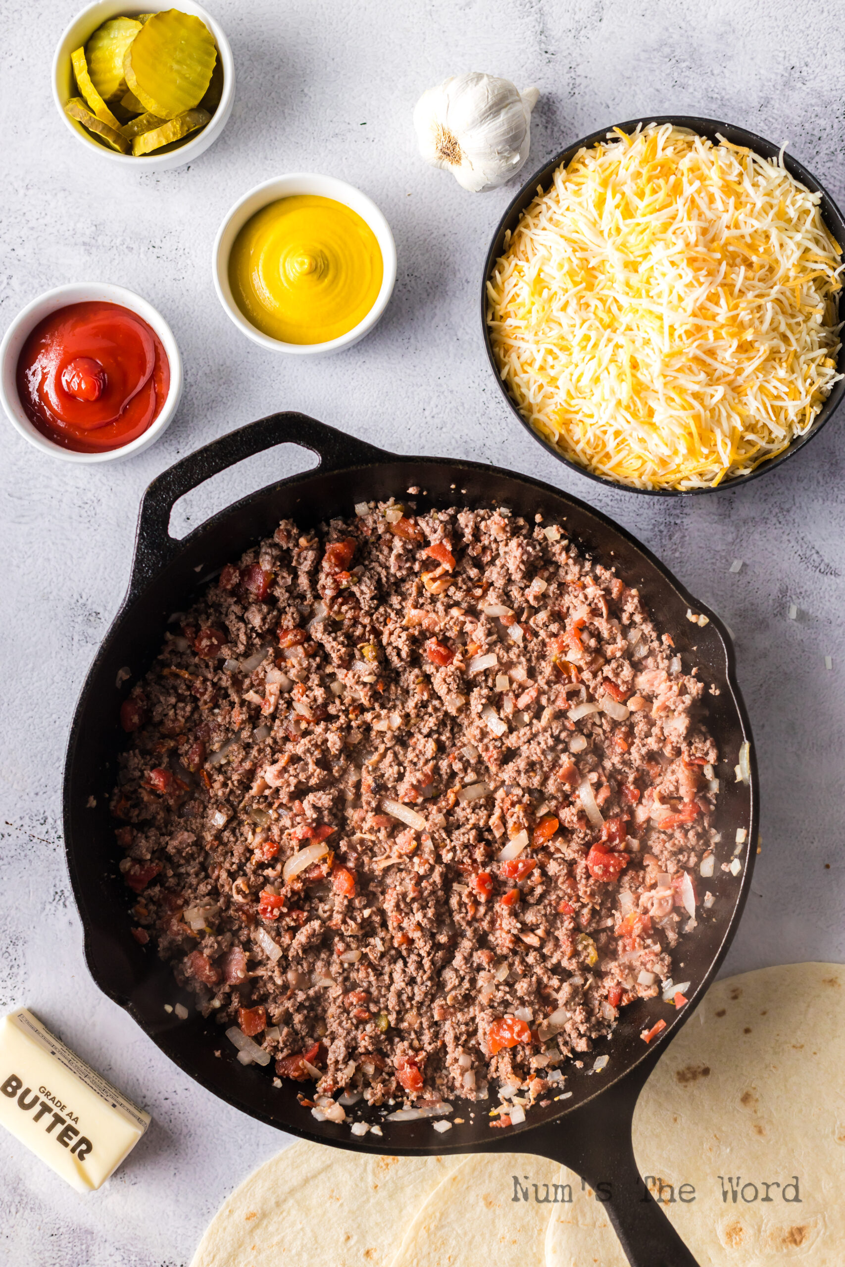 Cooked bacon ground beef mixture in a skillet