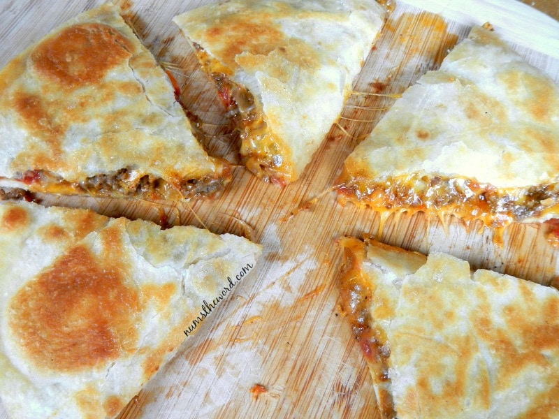 Mexican Quesadilla - Cooked quesadilla on a cutting board cut into 6 pieces.
