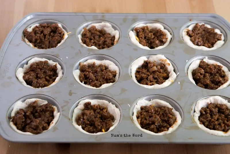 Barbecue Beef Cups - 4th step with ground beef on top of cheese