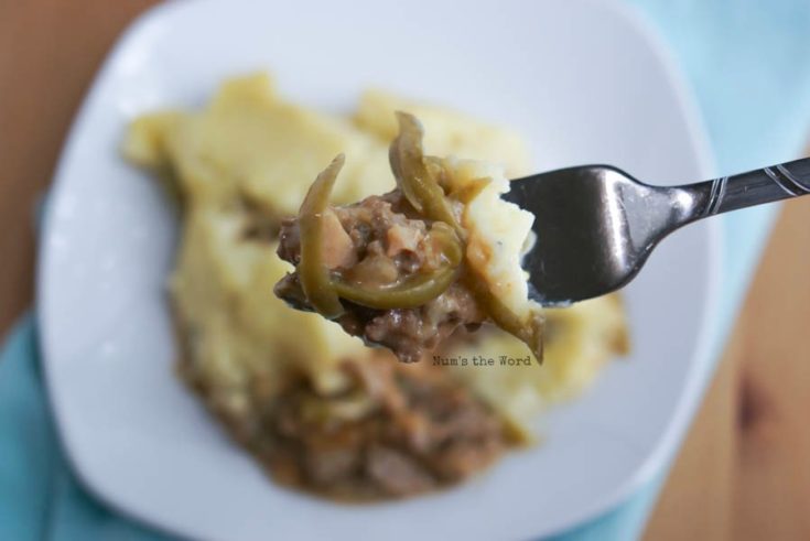 Salisbury Steak Casserole - fork full of casserole with a scoop in background