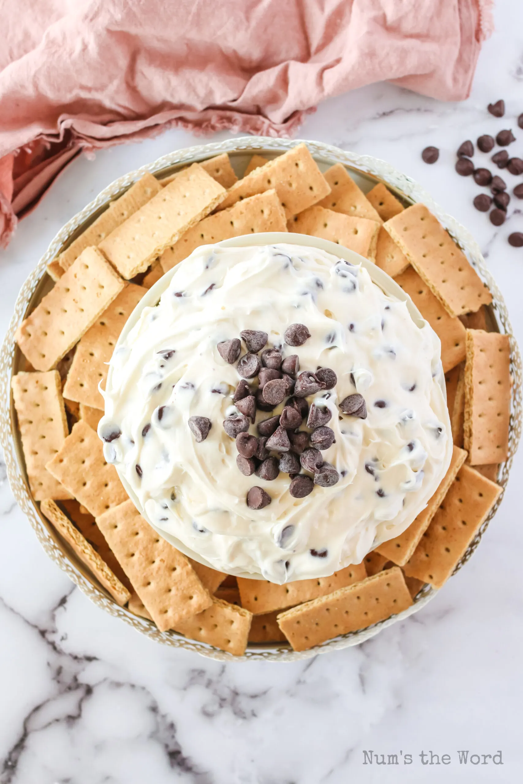 cheesecake dip in a bowl surrounded by graham crackers