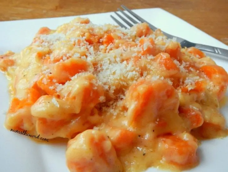 Cheesy Carrot Casserole - close up of casserole served on plate