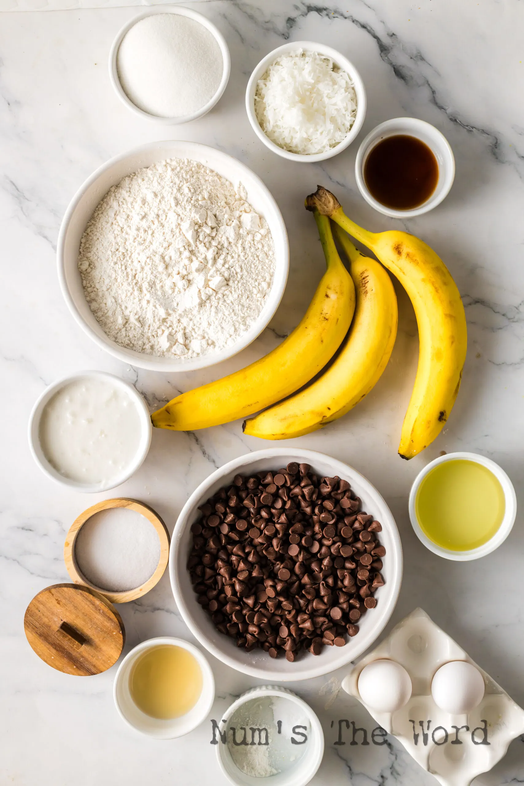 All ingredients for banana muffins laid out on counter.