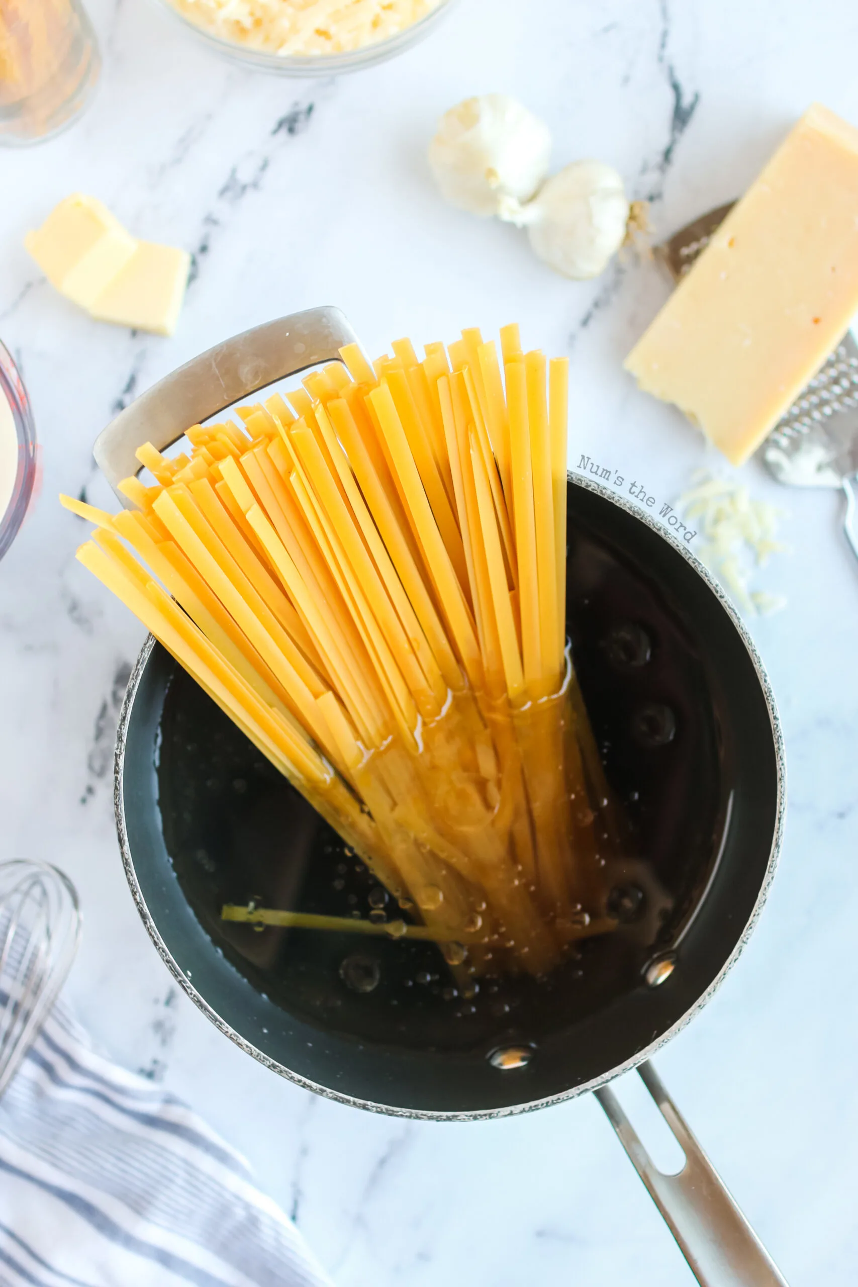 Fettuccine alfredo in a pot ready to be cooked