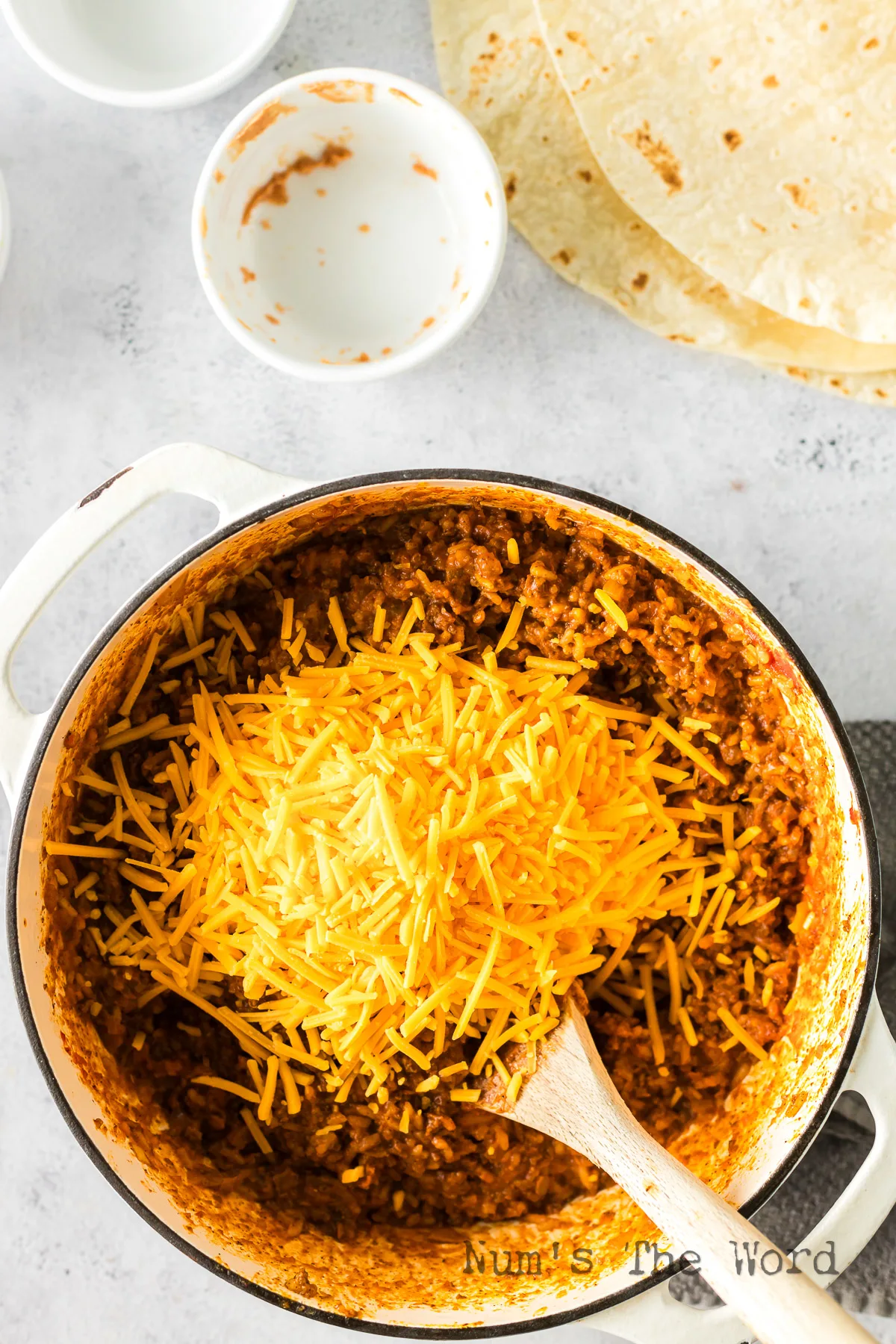 cheese added to chili cheese burrito mixture.