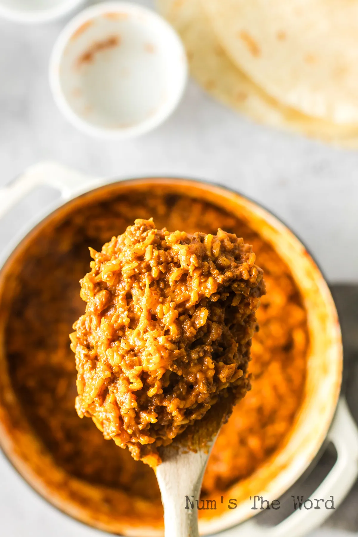 chili cheese mixture in pot, ready to assemble burritos