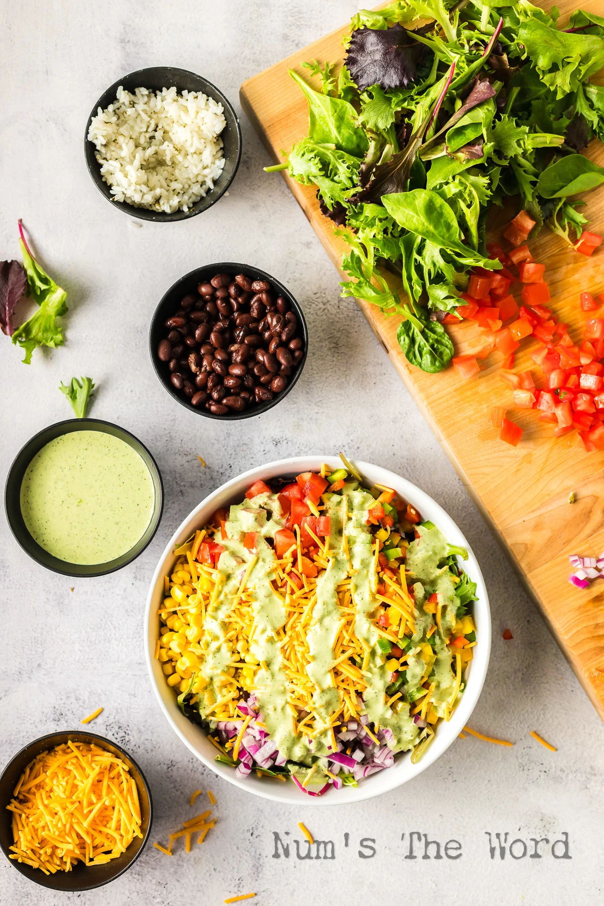Prepared salad with dressing drizzled on top.