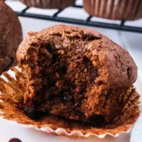 unpeeled muffin with a bite removed.