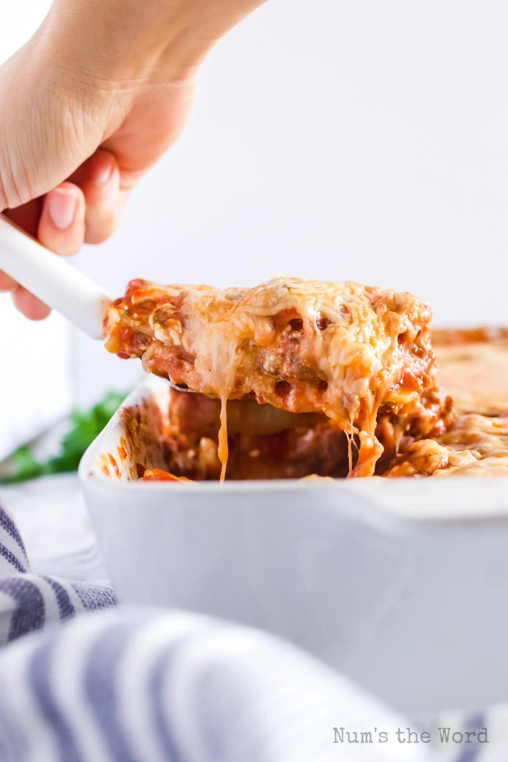 spatula scooping out a portion from casserole dish