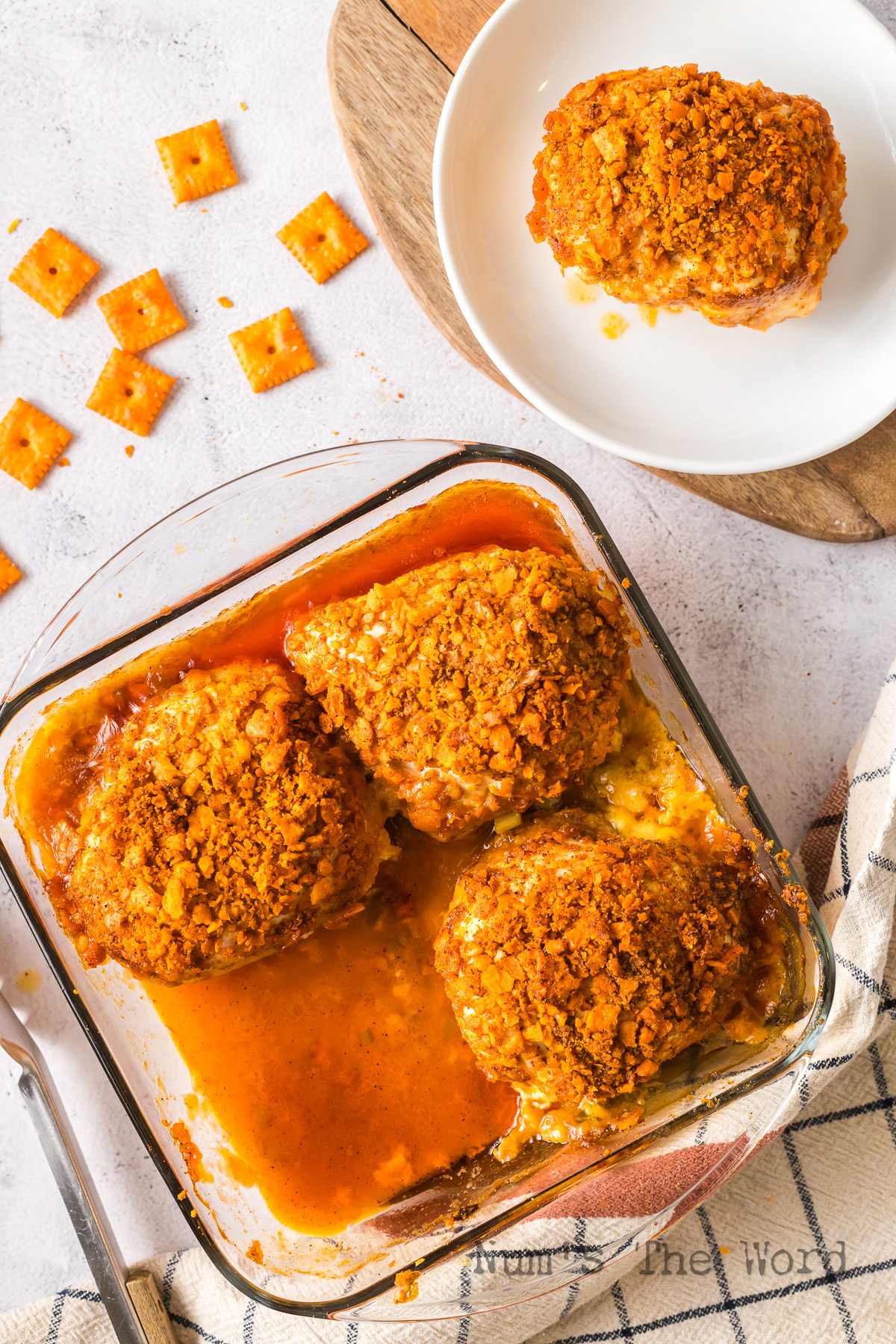 baked cracker coated breasts with one removed and plated