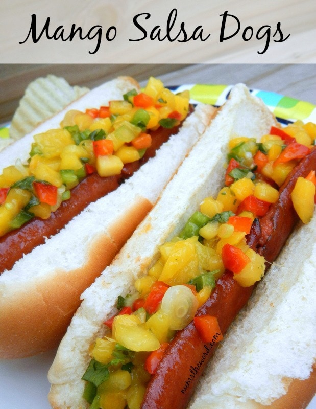 Mango Salsa Dogs - Main image for Recipe of two hot dogs on plate topped with mango salsa