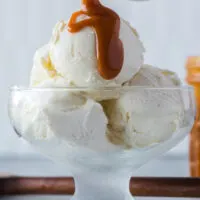 Caramel sauce being poured over ice cream
