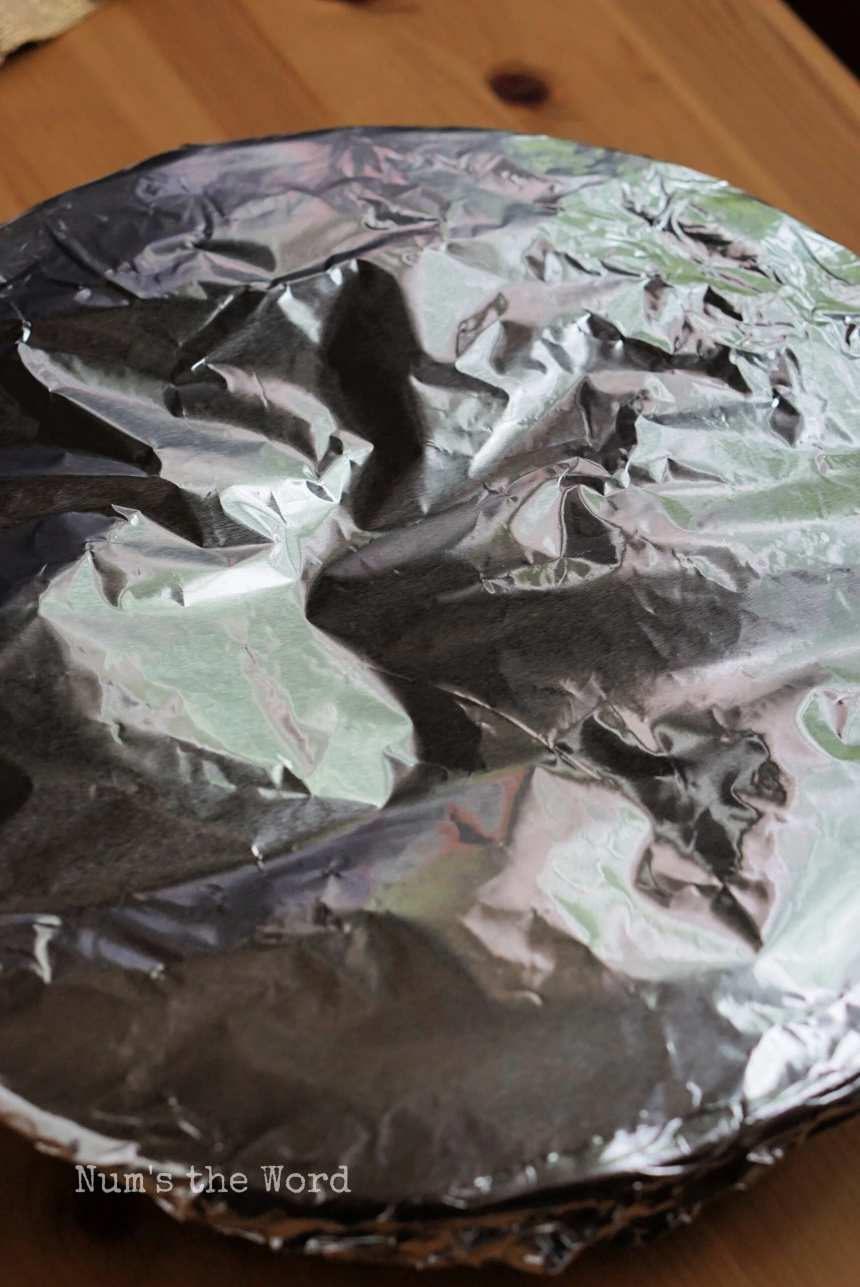 Tinfoil covering pie for baking. 