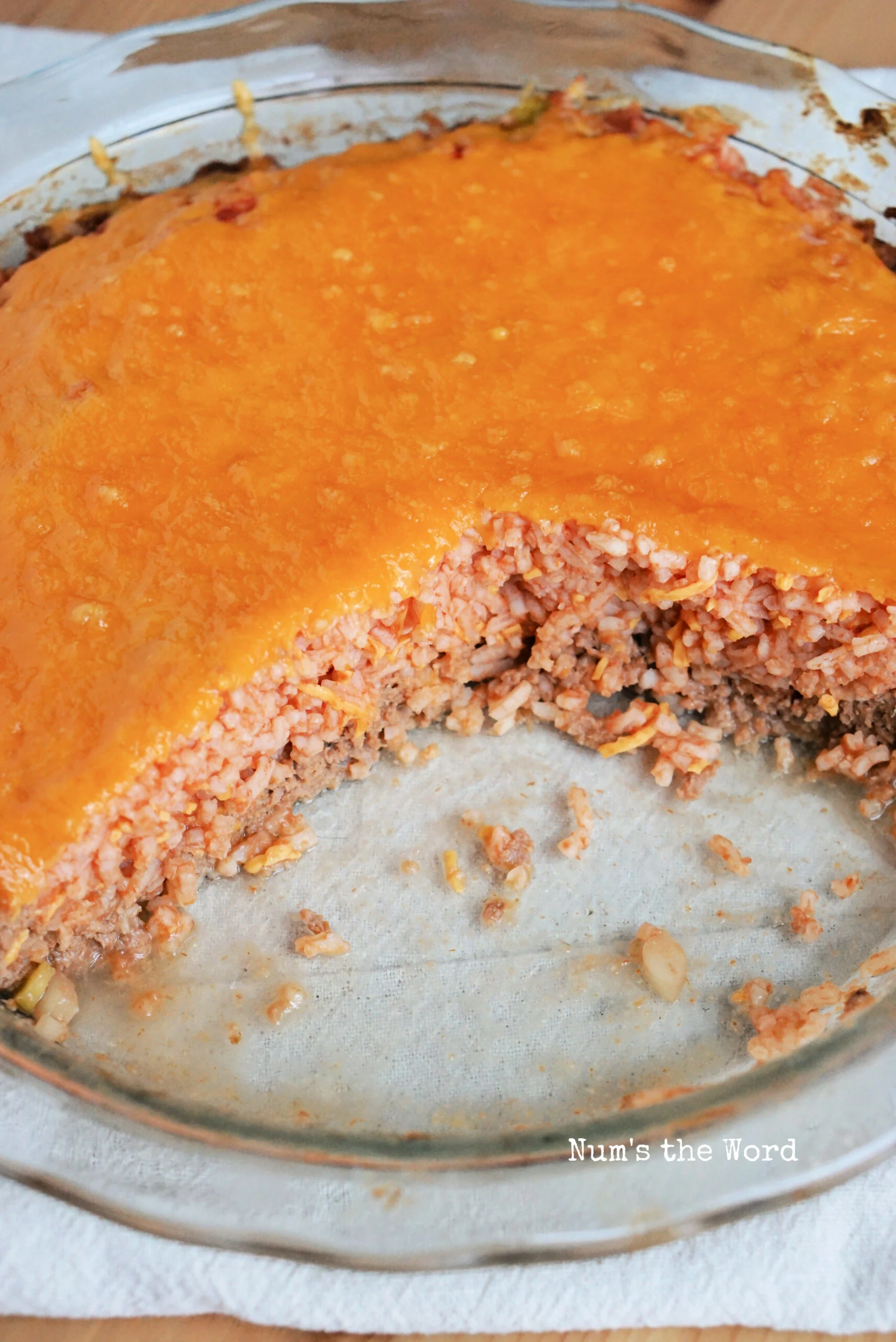 A triangle of pie removed from pie plate. Image shows the rice filling.