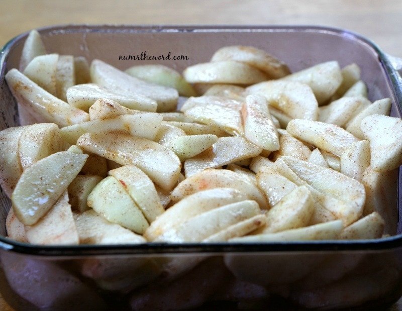 Apple Cobbler Cake - seasoned apples in casserole dish